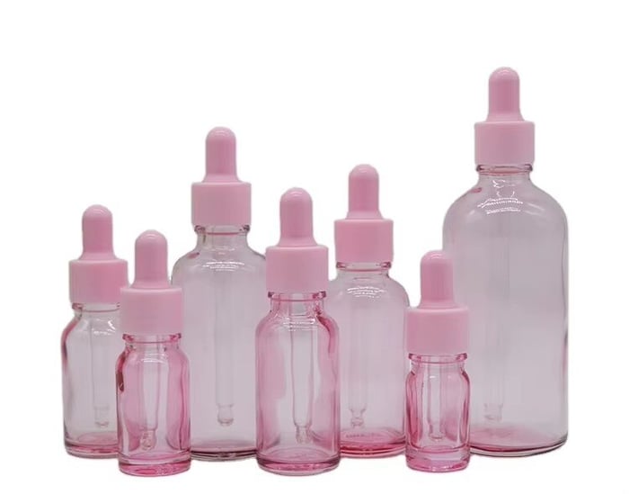 Pink glass dropper bottles image