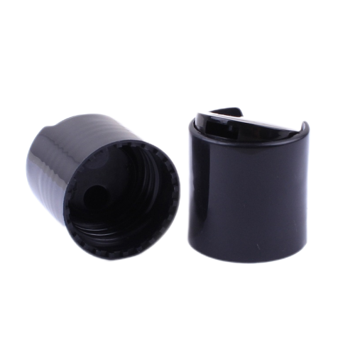 Plastic disc caps for shampoo bottles image