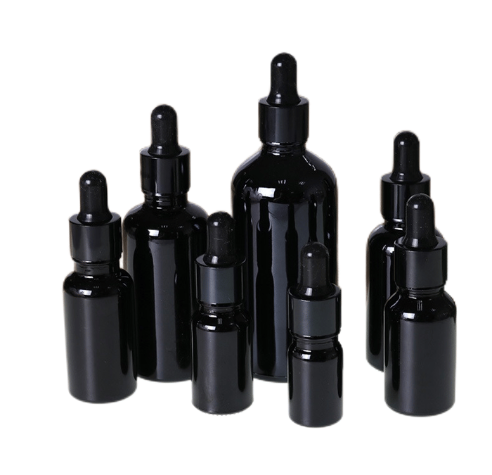 Glossy black glass dropper bottles image
